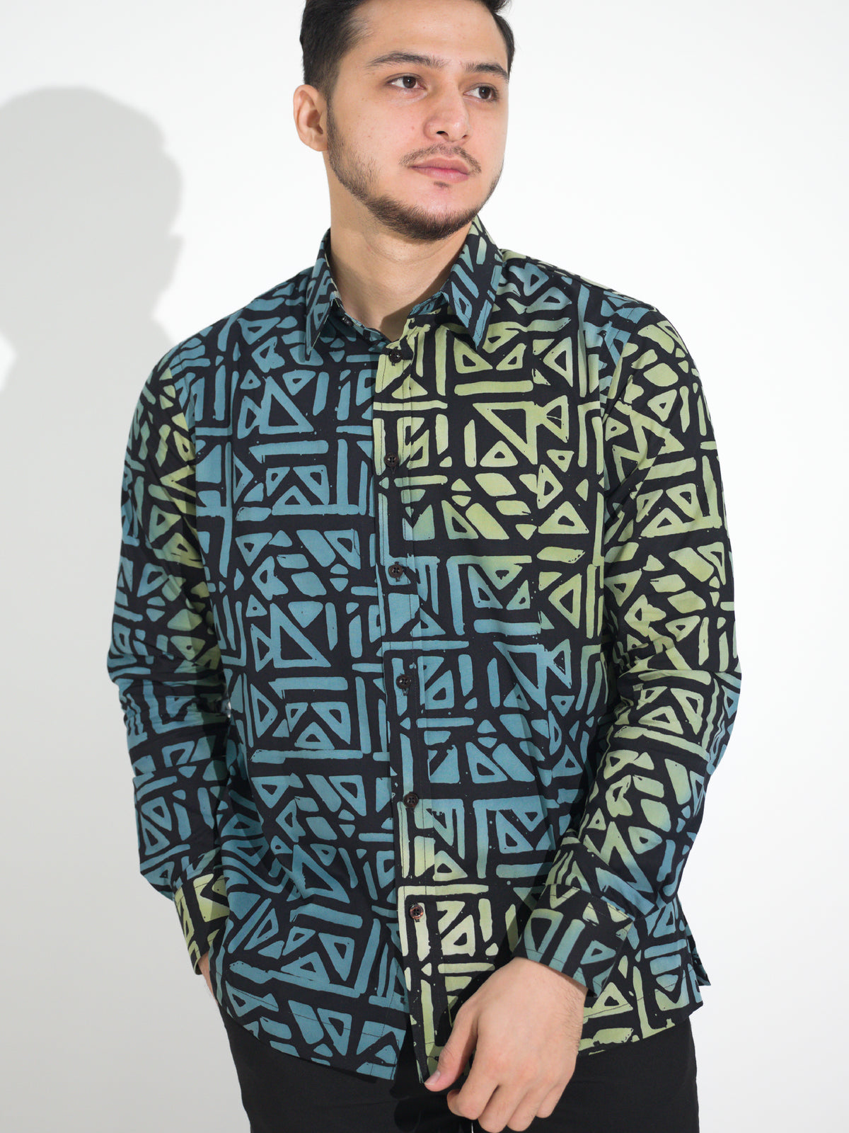 Gema GL901 long-sleeve batik shirt, black with teal and green geometric motif, close-up