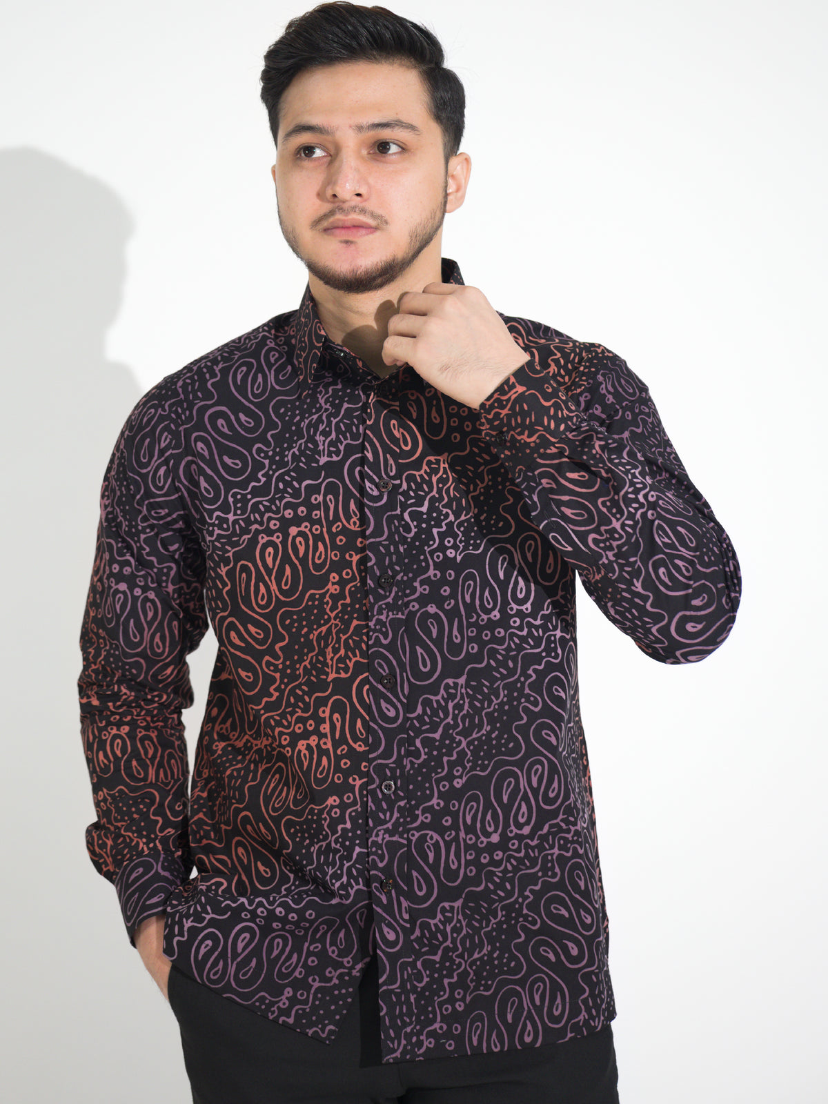 Gema GL903 long-sleeve batik shirt, black with rust and lilac paisley motif, close-up