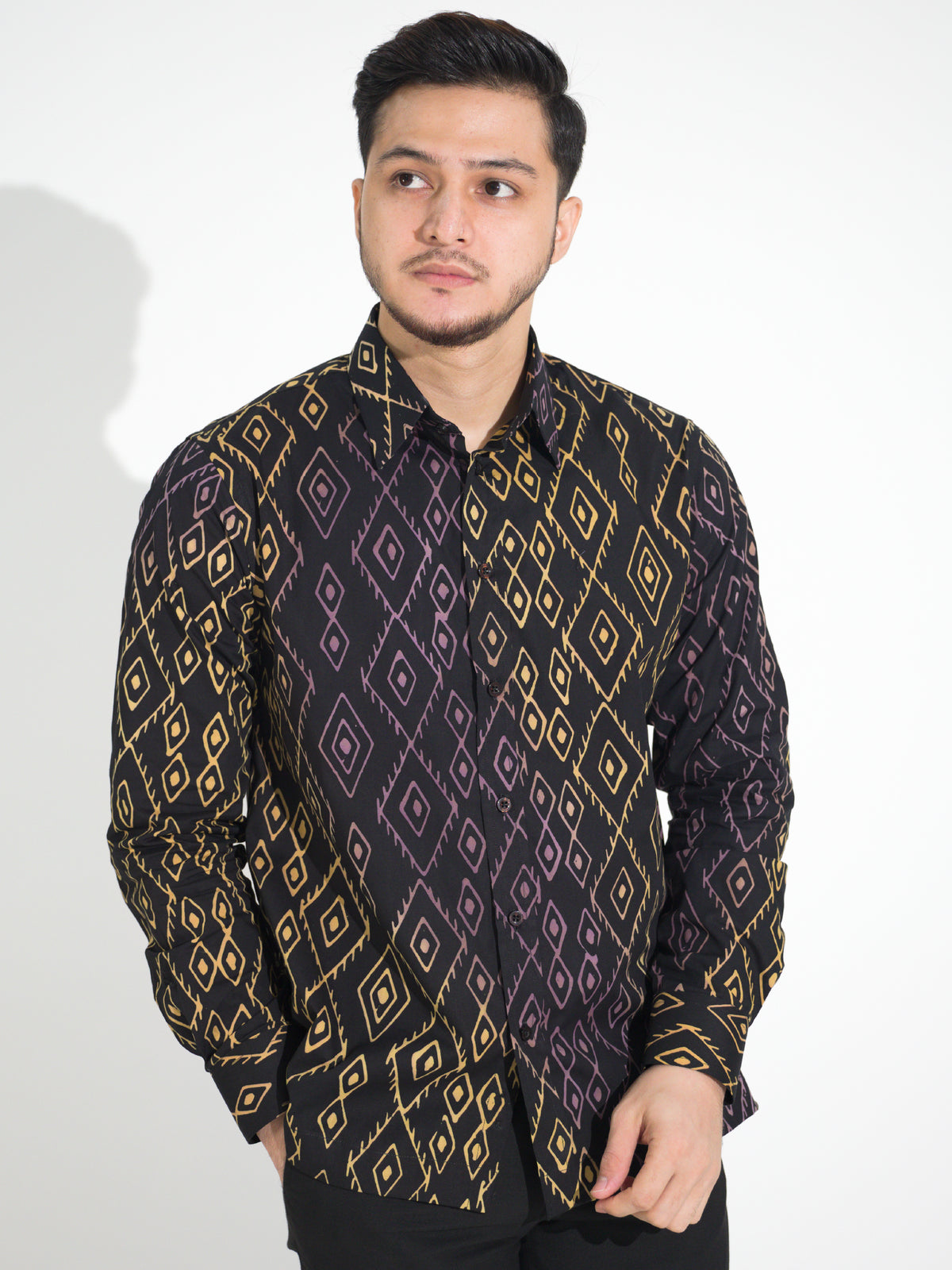 Gema GL905 long-sleeve batik shirt, black with gold and purple diamond motif, close-up