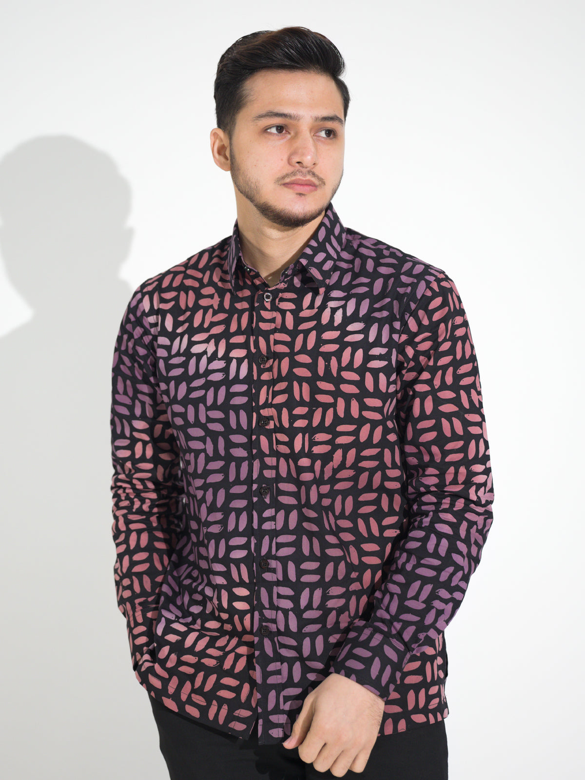 Gema GL906 long-sleeve batik shirt, black with coral and lilac petal motif, close-up