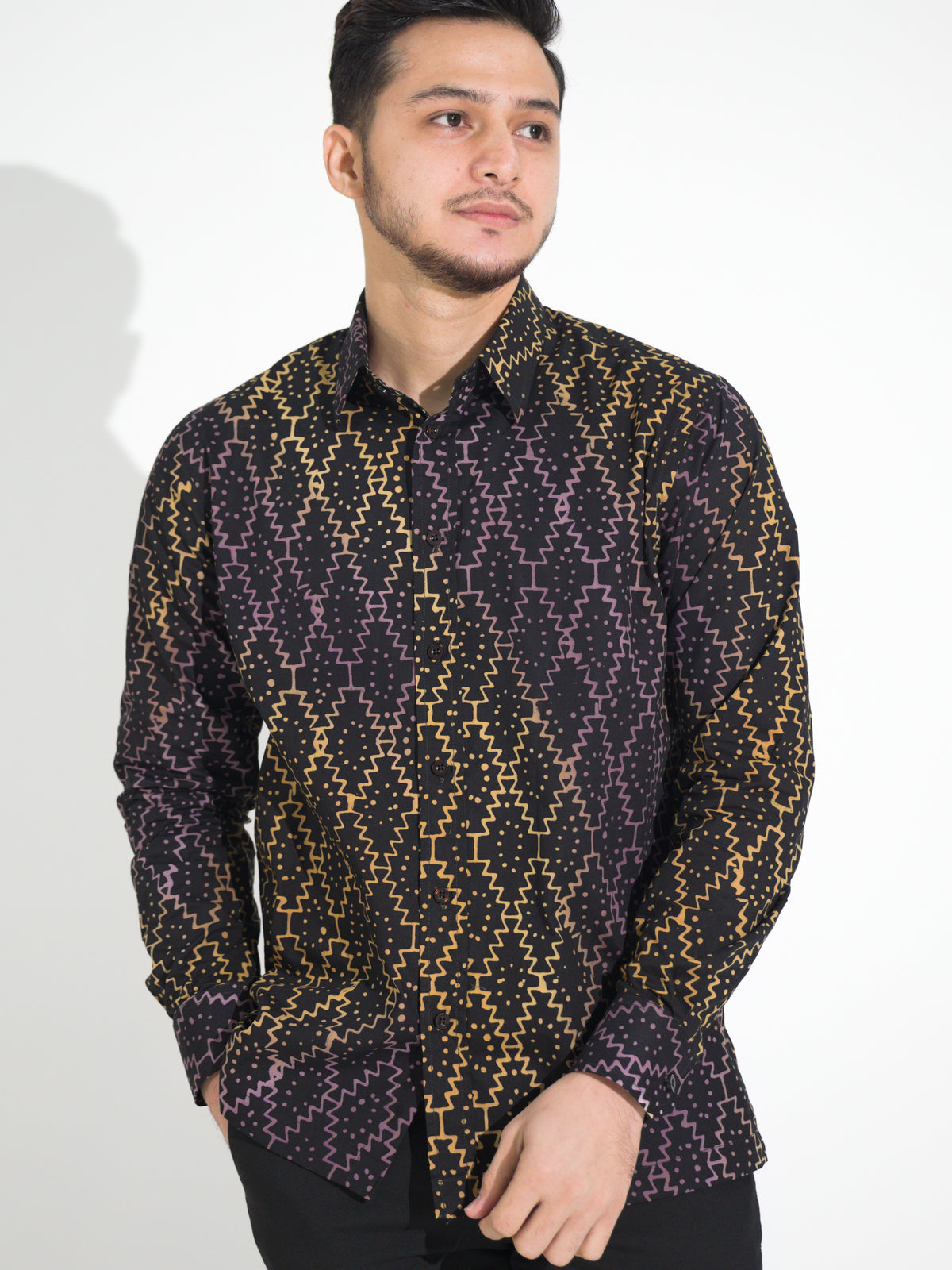 Gema GL907 long-sleeve batik shirt, black with gold and purple dotted diamond motif, close-up