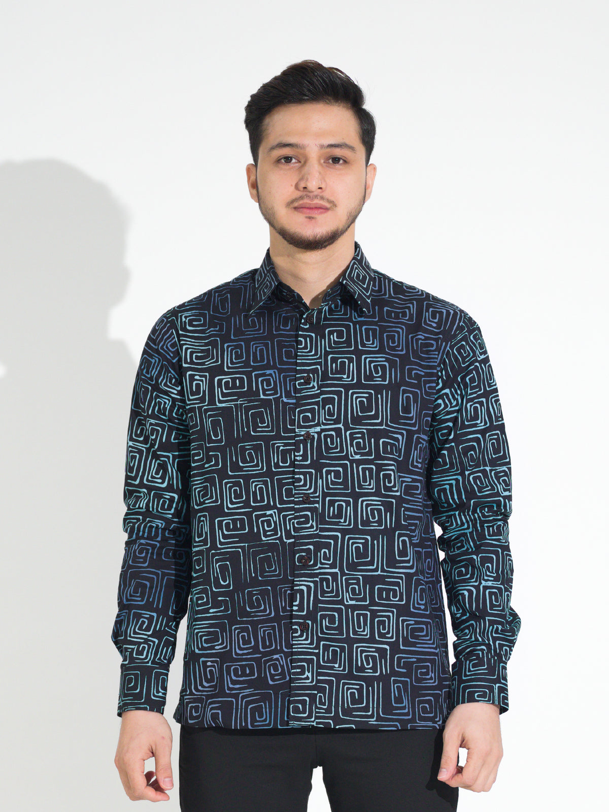 Gema GL913 long-sleeve batik shirt, black with teal and blue square spiral motif, front view