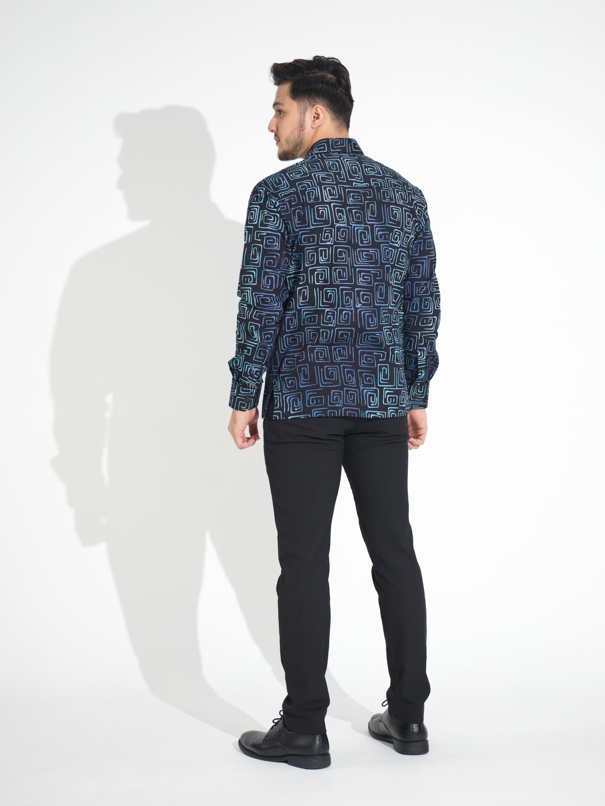 Gema GL913 long-sleeve batik shirt, black with teal and blue square spiral motif, back view
