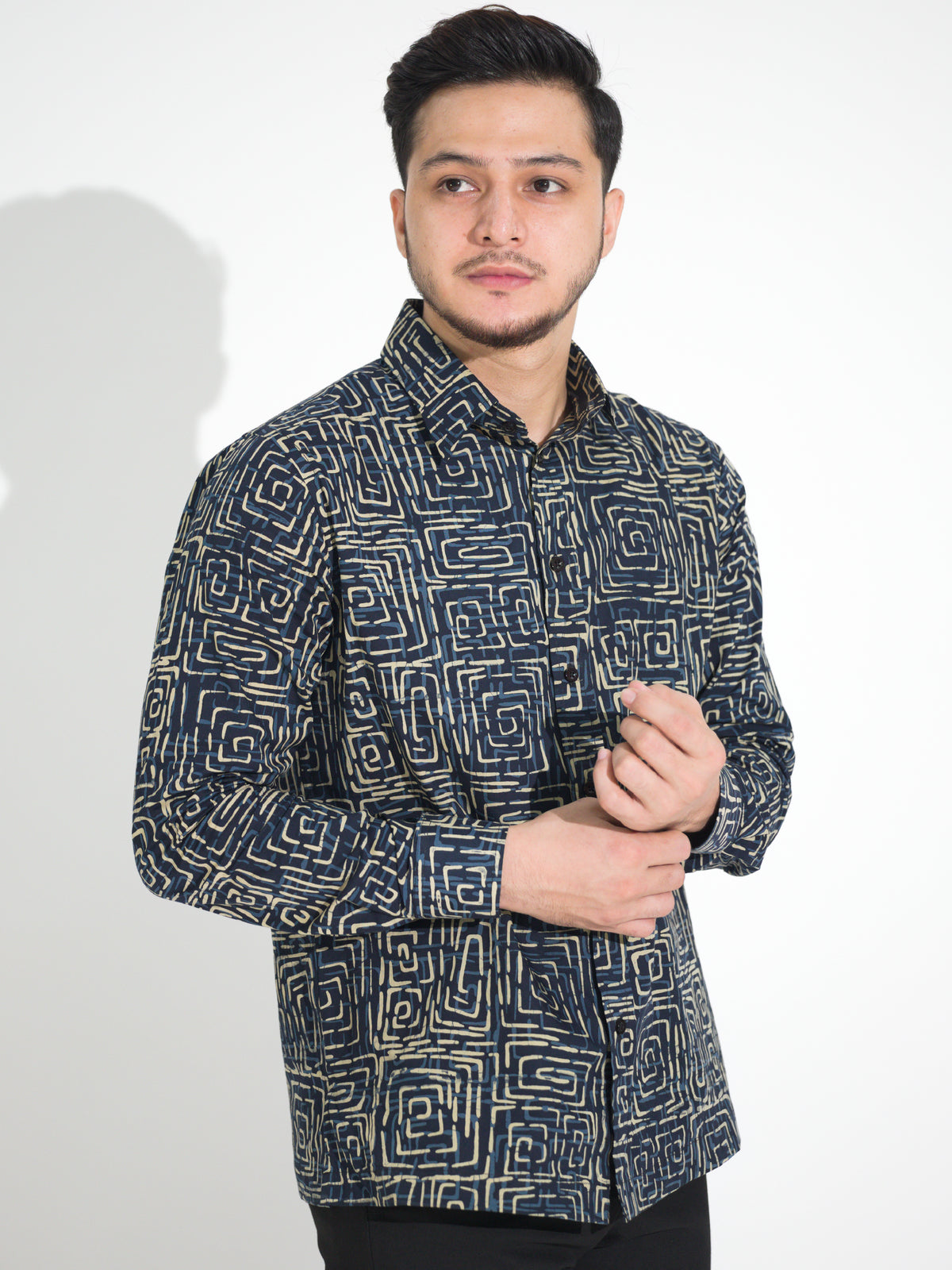 Ria RL901 long-sleeve batik shirt, navy with cream square spiral motif, close-up