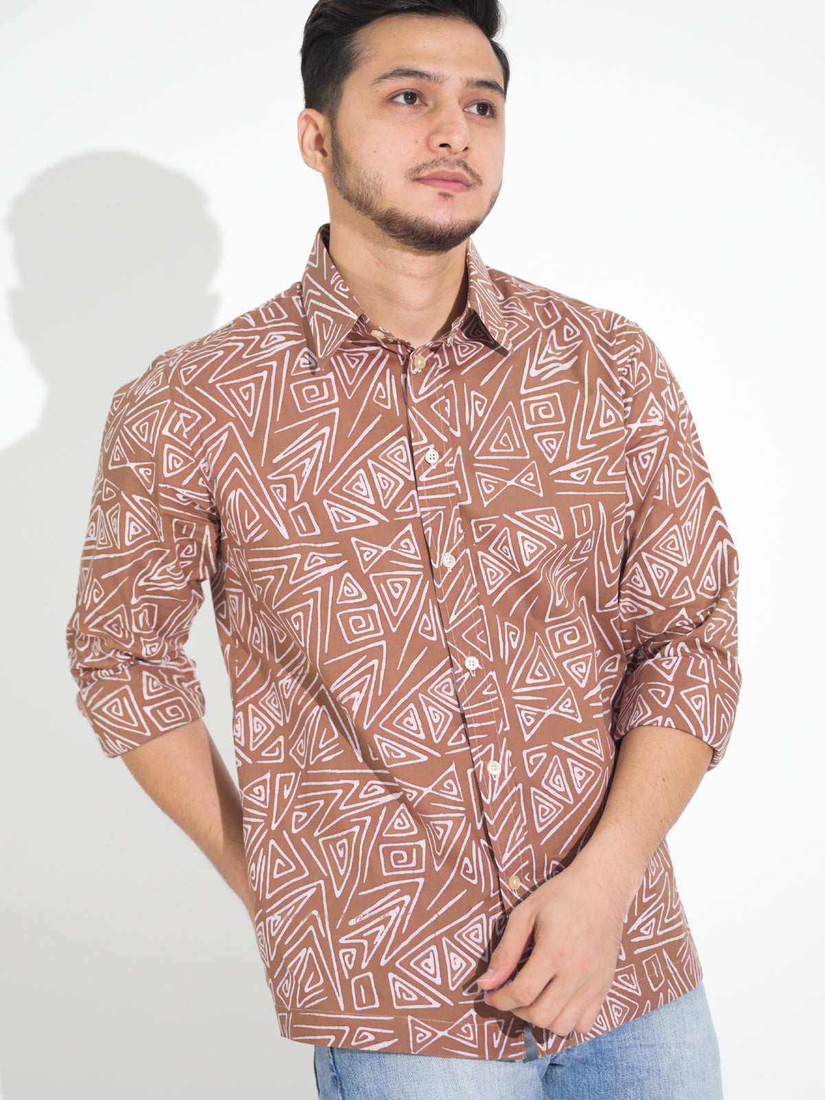 Tulus TL905 long-sleeve batik shirt, rust with white triangle motif, close-up